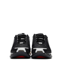 Baskets basses en caoutchouc noires Nike