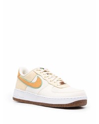 Baskets basses en cuir beiges Nike