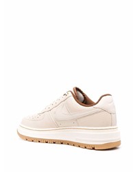 Baskets basses en cuir beiges Nike