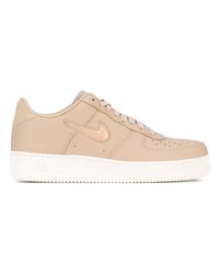 Baskets basses en cuir beiges Nike