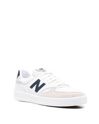 Baskets basses en cuir blanc et bleu marine New Balance