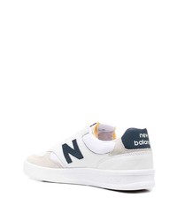 Baskets basses en cuir blanc et bleu marine New Balance