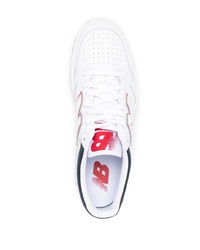 Baskets basses en cuir blanc et bleu marine New Balance