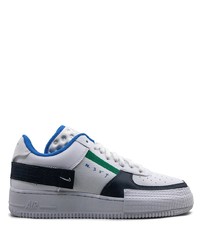 Baskets basses en cuir blanc et bleu marine Nike