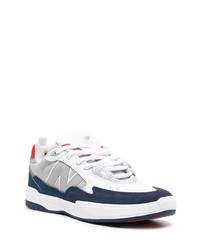 Baskets basses en cuir blanc et bleu marine New Balance