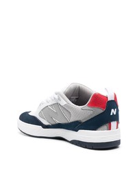 Baskets basses en cuir blanc et bleu marine New Balance