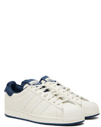 Baskets basses en cuir blanc et bleu marine adidas Originals