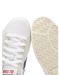 Baskets basses en cuir blanc et bleu marine Converse