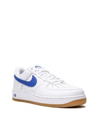 Baskets basses en cuir blanc et bleu Nike