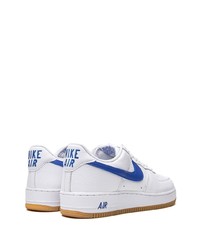 Baskets basses en cuir blanc et bleu Nike