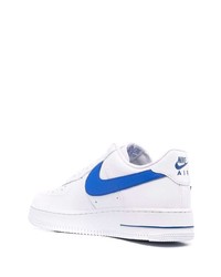 Baskets basses en cuir blanc et bleu Nike