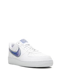 Baskets basses en cuir blanc et bleu Nike