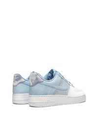 Baskets basses en cuir blanc et bleu Nike