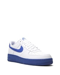 Baskets basses en cuir blanc et bleu Nike