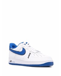 Baskets basses en cuir blanc et bleu Nike