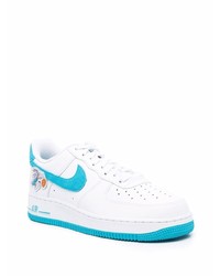 Baskets basses en cuir blanc et bleu Nike