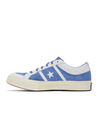 Baskets basses en cuir blanc et bleu Converse