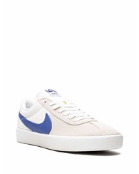 Baskets basses en cuir blanc et bleu Nike