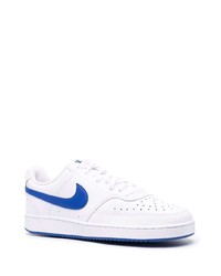 Baskets basses en cuir blanc et bleu Nike