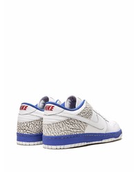 Baskets basses en cuir blanc et bleu Nike