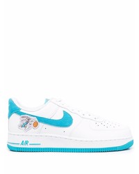 Baskets basses en cuir blanc et bleu Nike