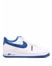 Baskets basses en cuir blanc et bleu Nike