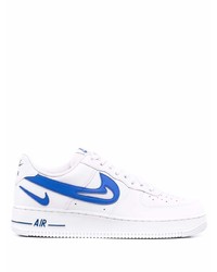 Baskets basses en cuir blanc et bleu Nike