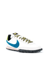 Baskets basses en cuir blanc et bleu Nike