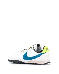 Baskets basses en cuir blanc et bleu Nike