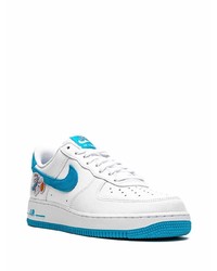 Baskets basses en cuir blanc et bleu Nike