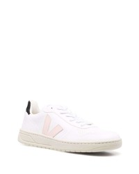 Baskets basses en cuir blanc et rose Veja