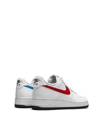 Baskets basses en cuir blanc et rouge Nike