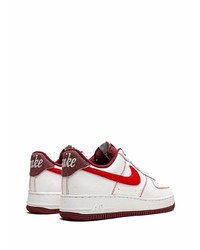 Baskets basses en cuir blanc et rouge Nike