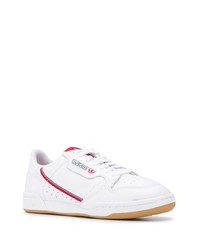 Baskets basses en cuir blanc et rouge adidas