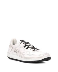 Baskets basses en cuir blanches et noires Premiata