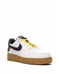 Baskets basses en cuir blanches et noires Nike