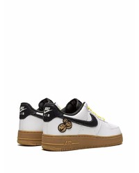 Baskets basses en cuir blanches et noires Nike