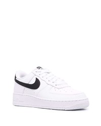 Baskets basses en cuir blanches et noires Nike