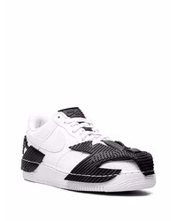 Baskets basses en cuir blanches et noires Nike