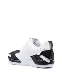 Baskets basses en cuir blanches et noires Nike