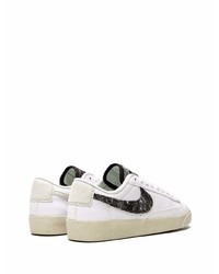 Baskets basses en cuir blanches et noires Nike