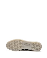 Baskets basses en cuir blanches et noires adidas