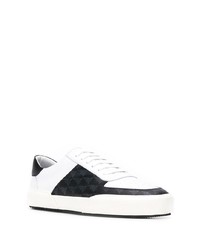 Baskets basses en cuir blanches et noires Amiri