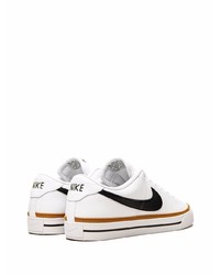 Baskets basses en cuir blanches et noires Nike