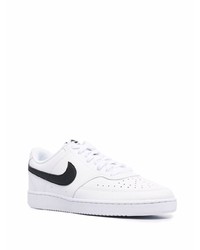 Baskets basses en cuir blanches et noires Nike