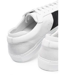 Baskets basses en cuir blanches et noires Axel Arigato