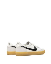 Baskets basses en cuir blanches et noires Nike