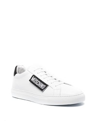 Baskets basses en cuir blanches et noires Moschino