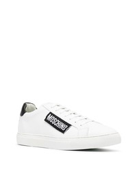 Baskets basses en cuir blanches et noires Moschino