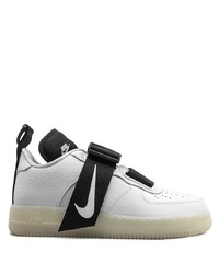 Baskets basses en cuir blanches et noires Nike